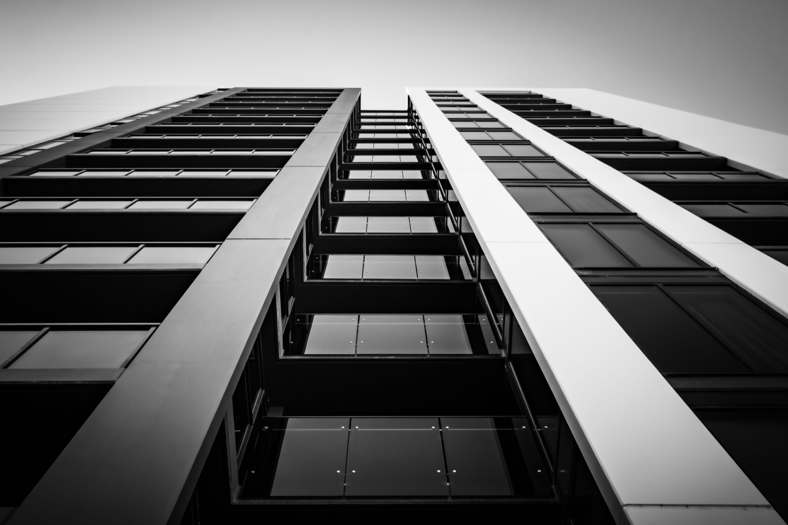 Workers on the upper floors of a high-rise development under construction
